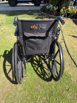 Rhythm Healthcare Folding Wheelchair in perfect condition