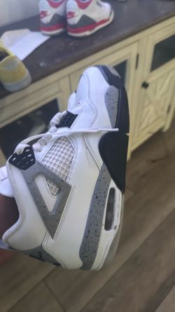 Jordan 4s white cements