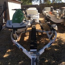 2005 Kawasaki JTII200 STXRk less than 100 hrs on it and comes with a double trailer.
