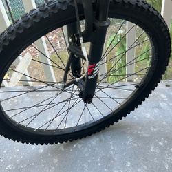 A Bike With A Broken Tire And Brakes