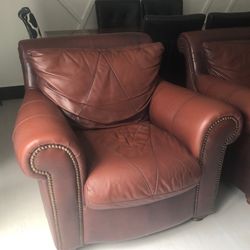 Brown couch and loveseat