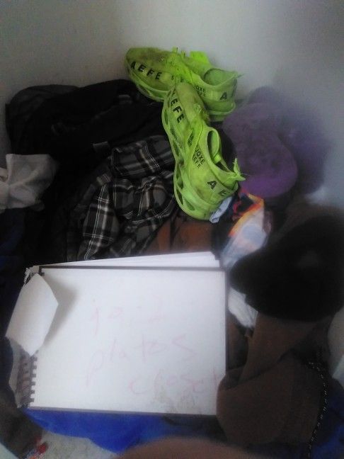 Bunch Of Clean Clothes Shoes And A Backpack