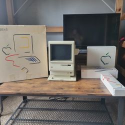 Macintosh 128k in box, 1MB upgrade, keyboard in box, mouse in box, external floppy in box, starter kit