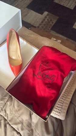 Orange Christian Louboutin paris red bottoms