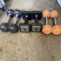 Three sets of dumbbells