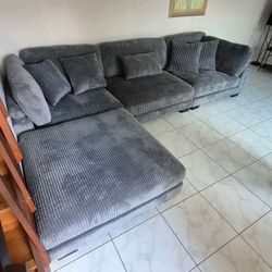 New gray sectional sofa in perfect condition for sale