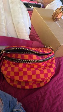 The purse that holds the whole gallon of milk. I have a black and white one and a pink and orange one.
