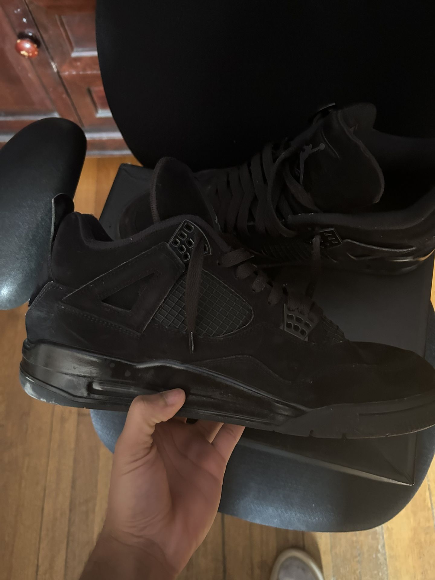 Black cat Jordan 4s