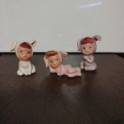 3 Vintage Porcelain Figurine Babys In Bunny Onesies 