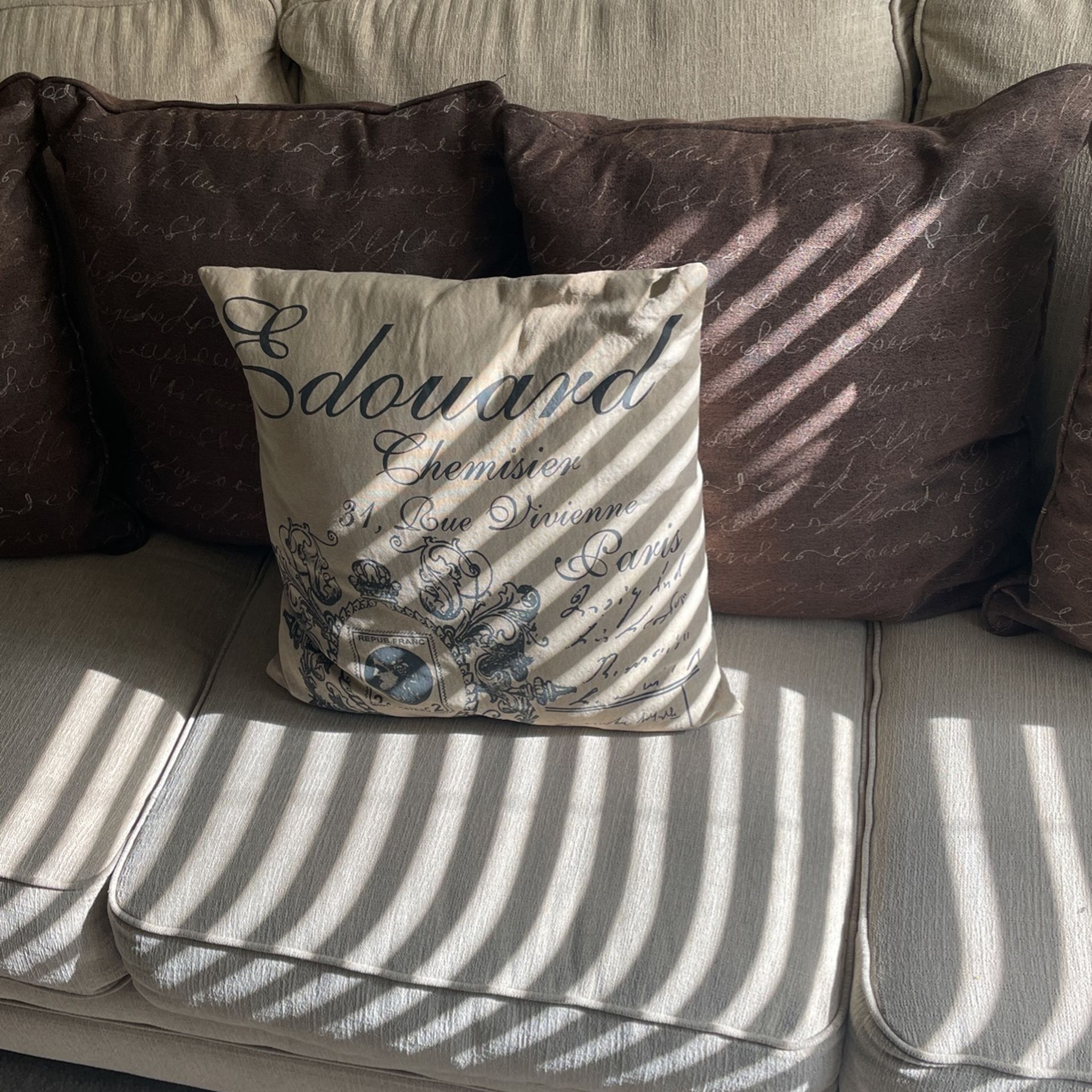 Beige Sofa With Bronze Tackle Embellishments