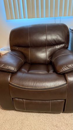 Brown new leather fox recliner.