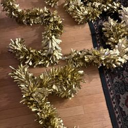 four strands of gold holiday garland each strand 6 foot long 