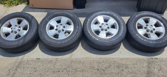 Tires and rims for a Toyota Tacoma truck