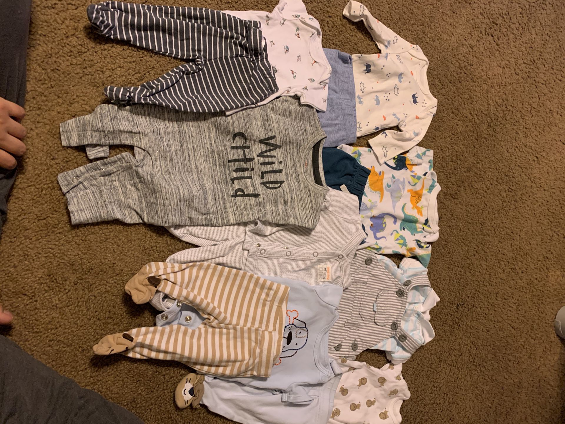 Newborn boy clothes and 27 size 1 diapers
