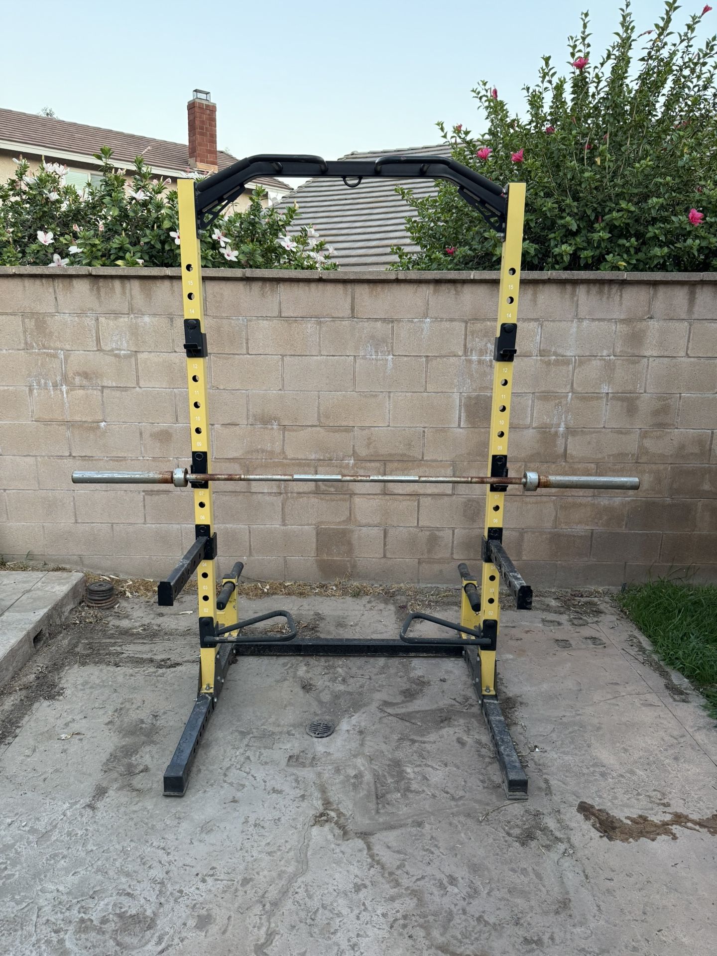 To post weight rack with curl bar and Olympic bench bar