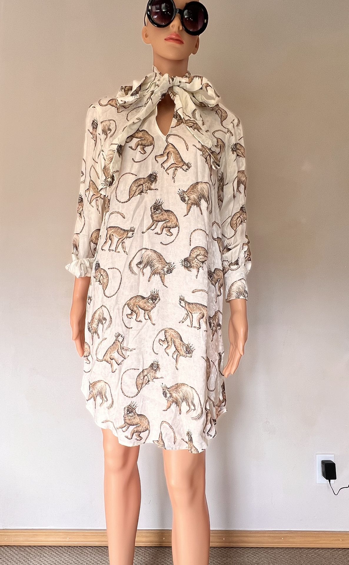 Size 2 charming white dress featuring a delightful monkey print