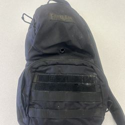 The product shown is a CamelBak M.U.L.E. hydration backpack, typically featuring a 100oz (3L) reservoir capacity for water storage