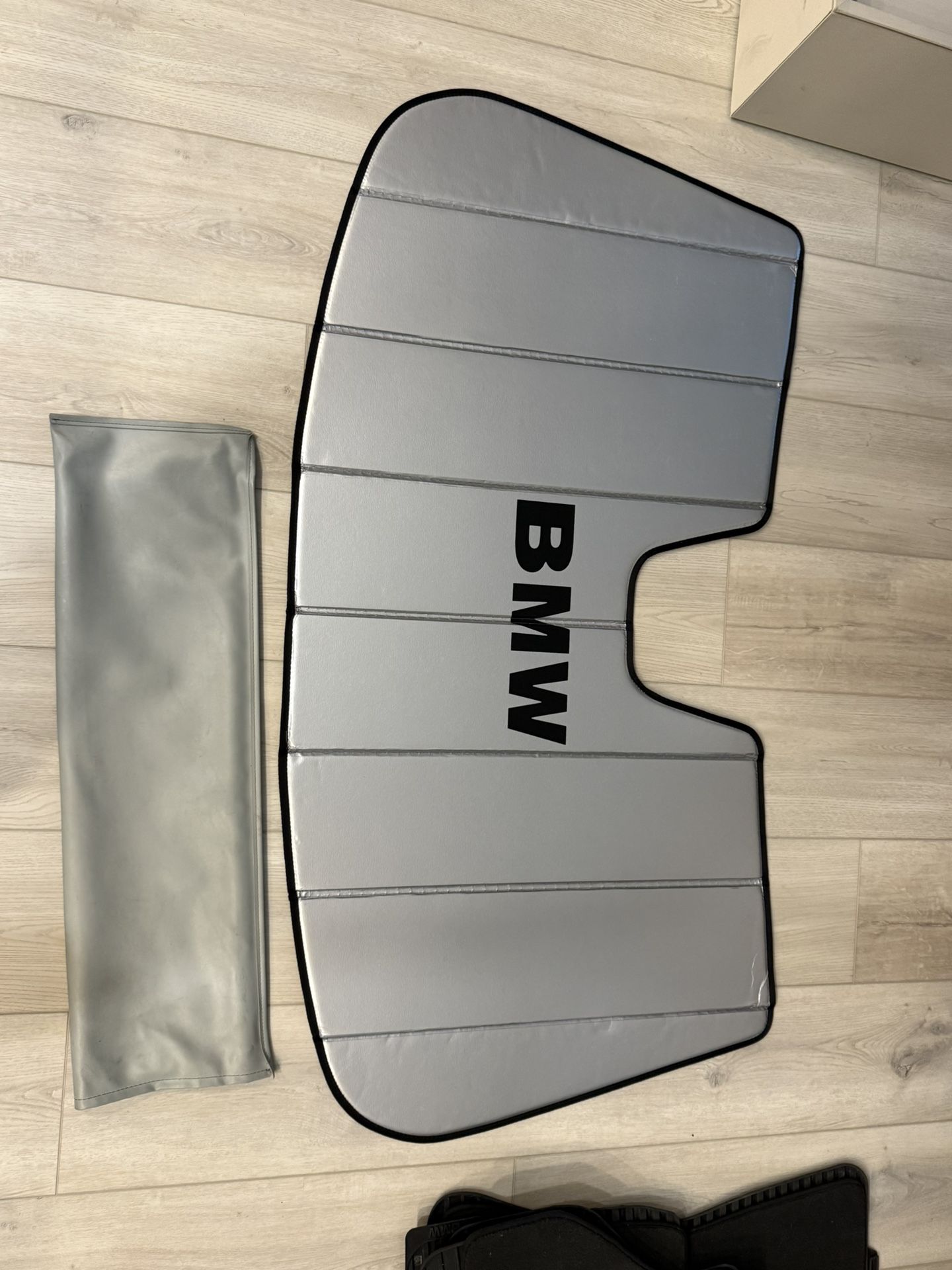 BMW X5 M Sun Visor, Rear Seat Cover and Floor Mats. Tire Wheel Covers. BMW hangar