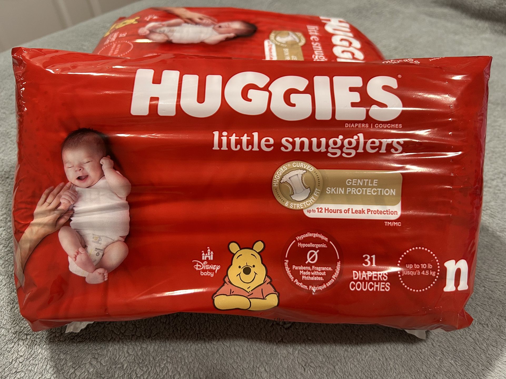 NEW!!! BOXES OF NB HUGGIES DIAPERS