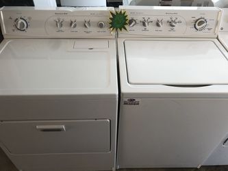 A white Kitchen Aide set of washer and dryer