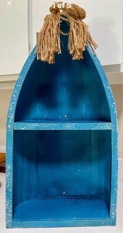 Wooden canoe shelving unit. Can be hung
