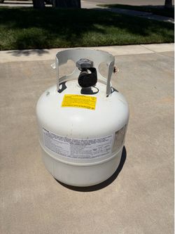 Propane Tank - it’s empty, but can be refilled or you can exchange it for a filled one. BBQ, Heater