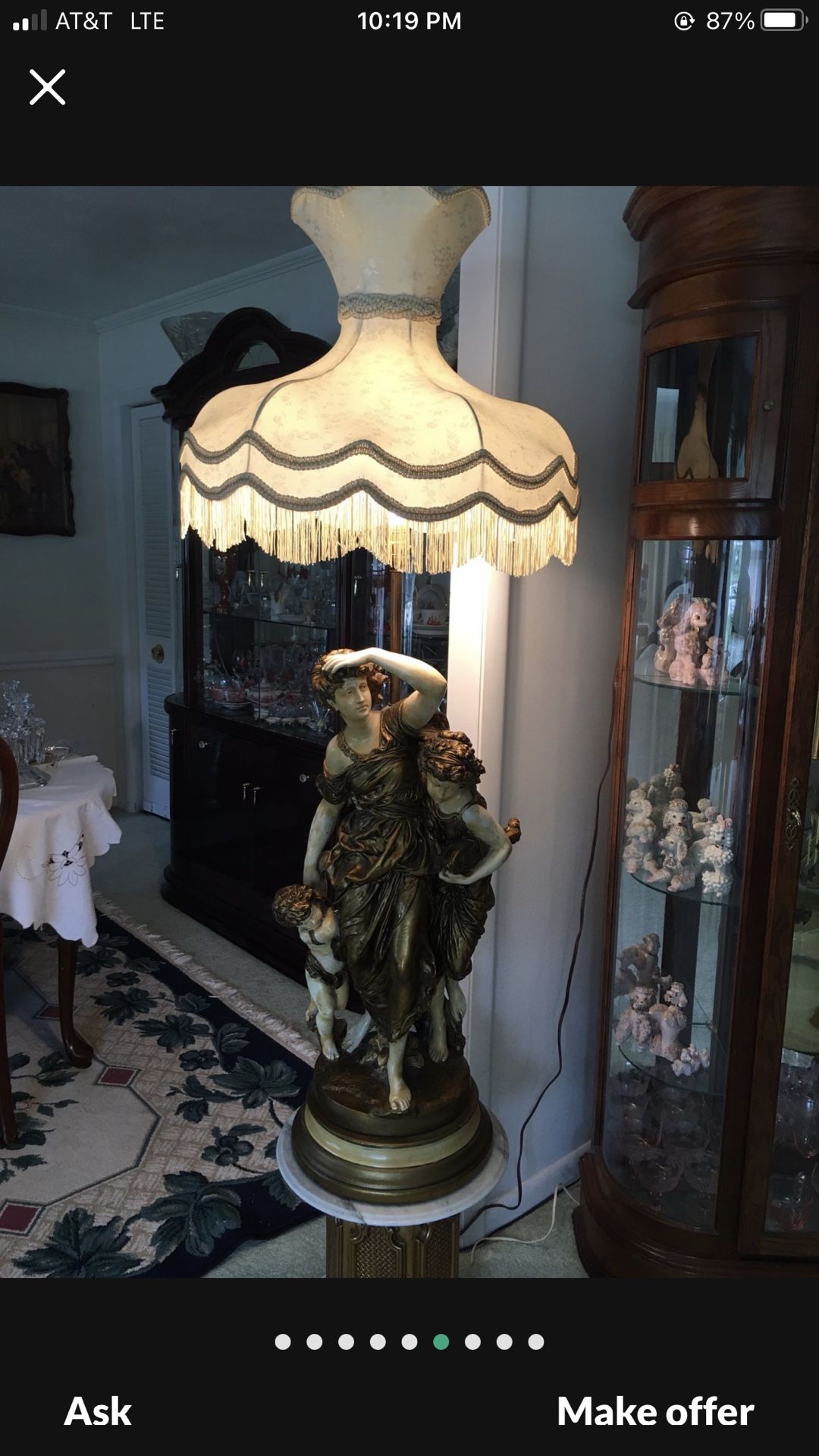 ANTIQUE LAMP. STATUE IS 32 TALL WITH LAMP SHADE IT IS 55 TALL