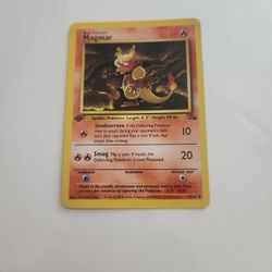 1999 first edition Magmar Pokémon card from the Fossil set. 