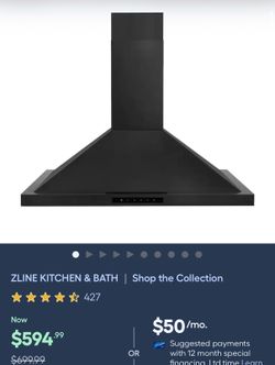 Sleek black ZLINE range hood. Has modern design.