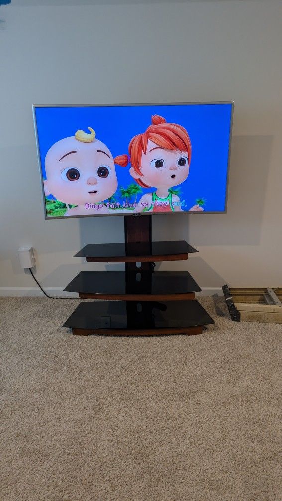 55" curved TV and stand.  Roku system. h