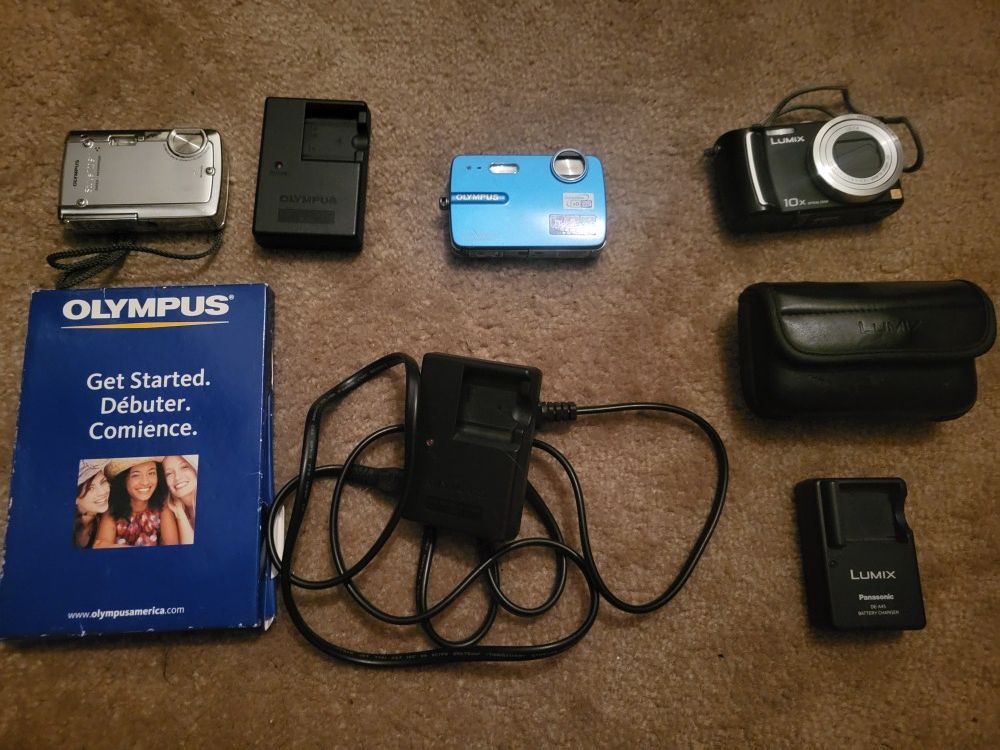 Set Of 3 Digital Cameras W/ Chargers (2 Olympus & 1 Lumix)