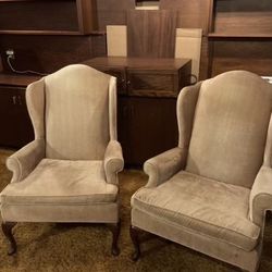 two elegant gold hi back chairs