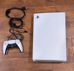 PlayStation 5 with controller and cables