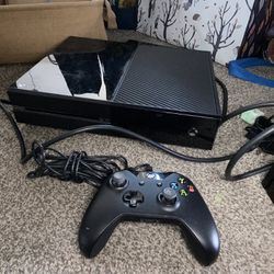 Black Xbox One And Two Controllers