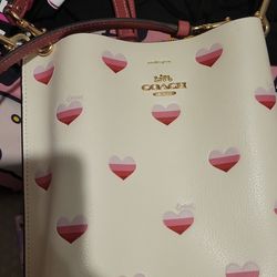 RARE NO LONGER MADE Coach purse cream crossbody bag with hand held strap all over pink hearts real leather