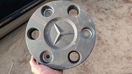 genuine Mercedes-Benz OEM wheel hub cap typically used on Mercedes-Benz Sprinter van