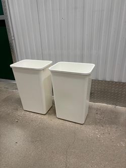 Two white plastic 22” tall trash cans .. $25 for both