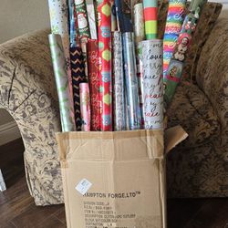 Assorted Rolls Of Christmas Wrapping Paper 
