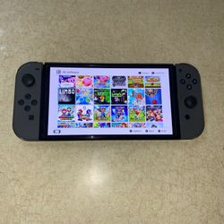 NINTENDO SWITCH OLED with 125 SWITCH GAMES