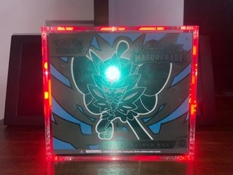 Twilight Masquerade Elite Trainer Box 120$ comes with glass case and free pop Pikachu .