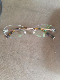 Miu Miu Rimless Oval Eyeglasses Frames