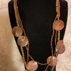 Triple Strand Wooden And Clear Beaded Necklace With Dangling Wooden Pendants