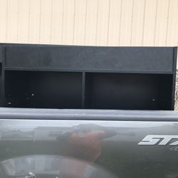 Two black storage cubes with shelfs included