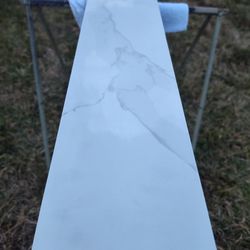 White Carrera marble curb or windowsill