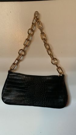 black purse with gold chains