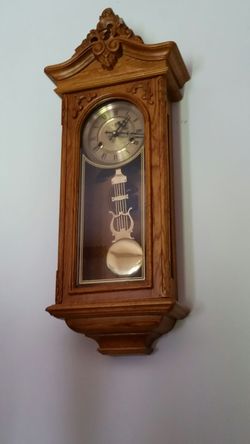 Chiming oak wall clock