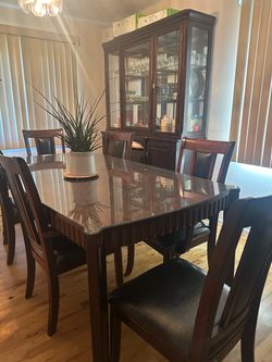 Dining Table with 6 chairs and a China cabinet