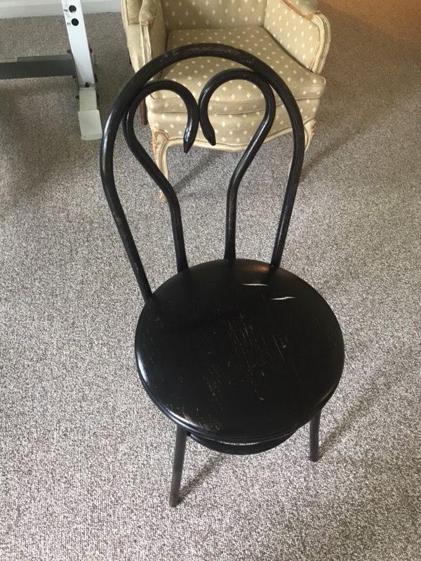 Black metal chair with padded seat