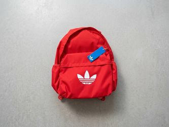 Adidas Originals red backpack with white trefoil logo