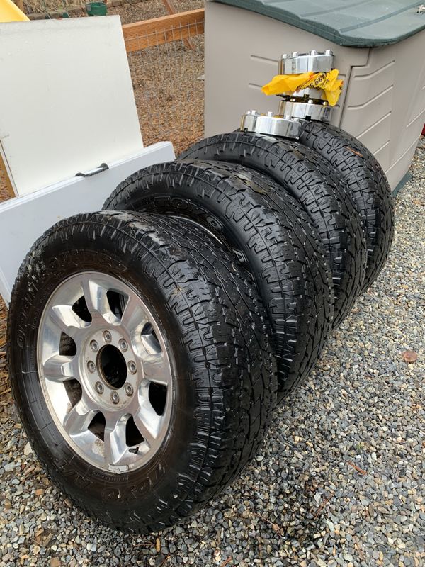 33 inch toyo all terrain tires with 20 inch chrome stock rims for Sale